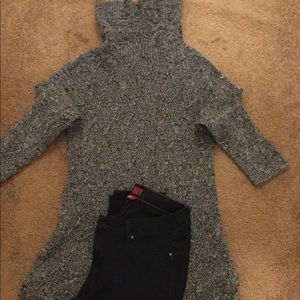 A sweater and dark blue jeans